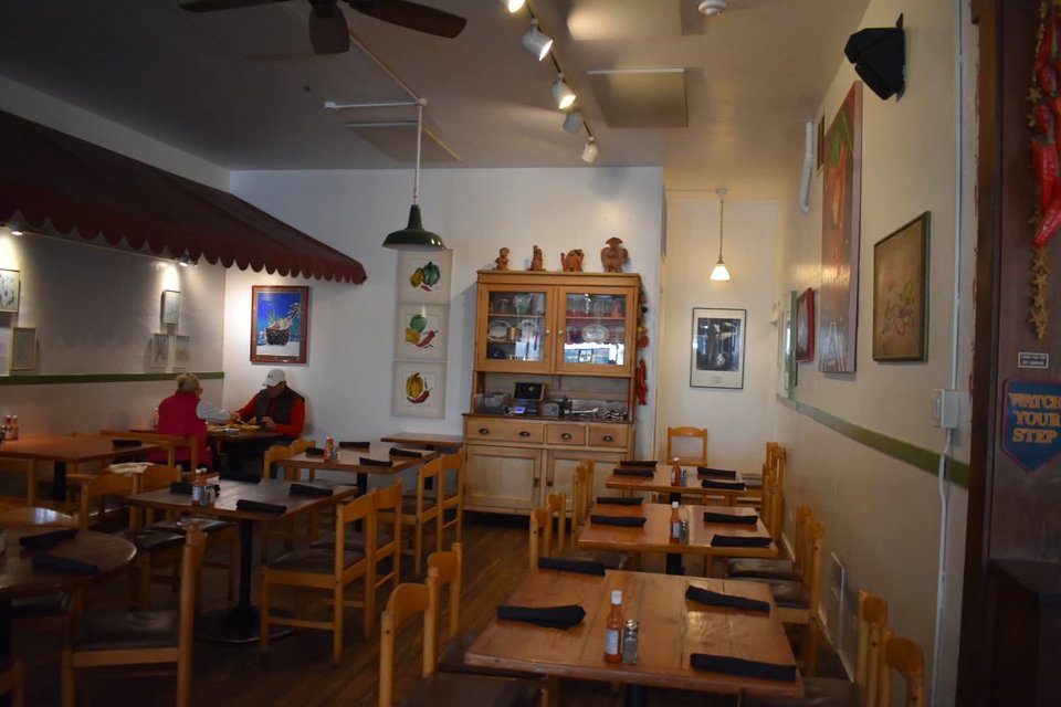 Family-friendly dining room with booths and warm lighting.
